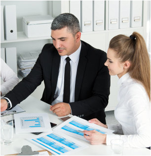 man and woman talking to each other about their work