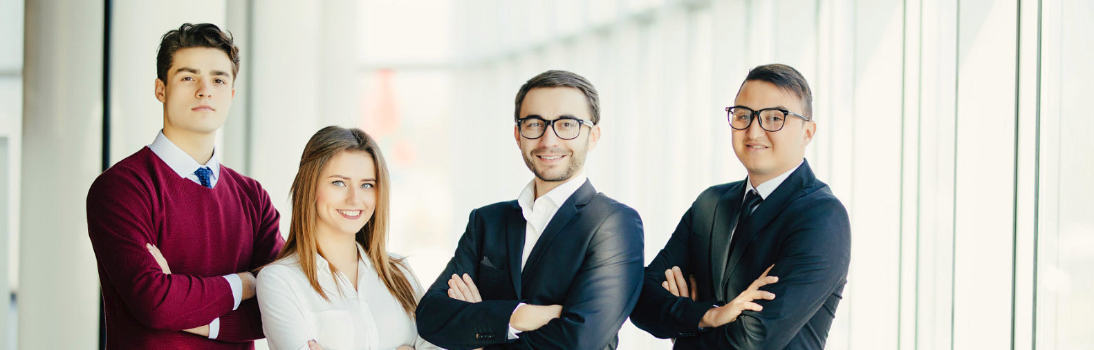 group of people posing in the front of the camera