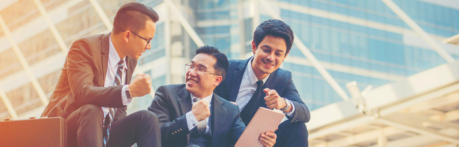 three business men having a great time